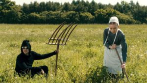 David in a field with an amish.